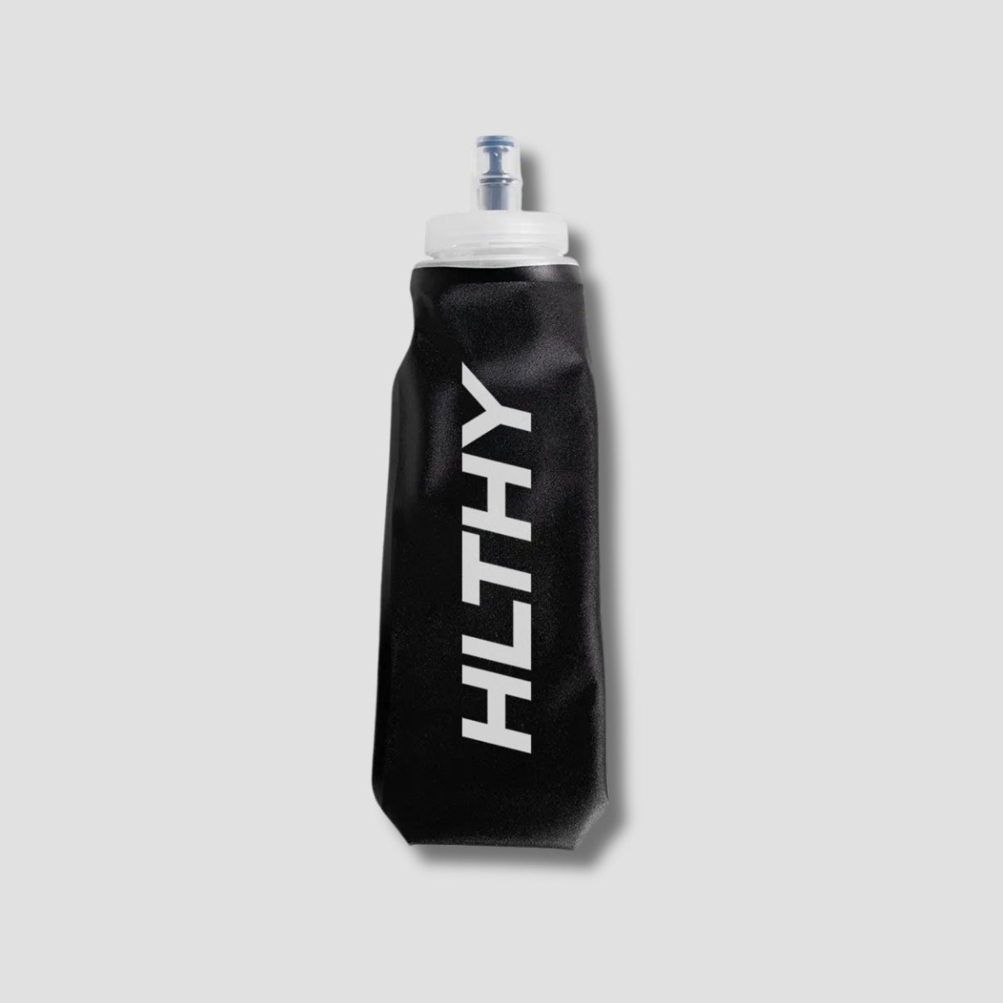 Flat lay of the HLTHY soft flask water bottle, showing its lightweight, flexible material and durable construction for long-term use