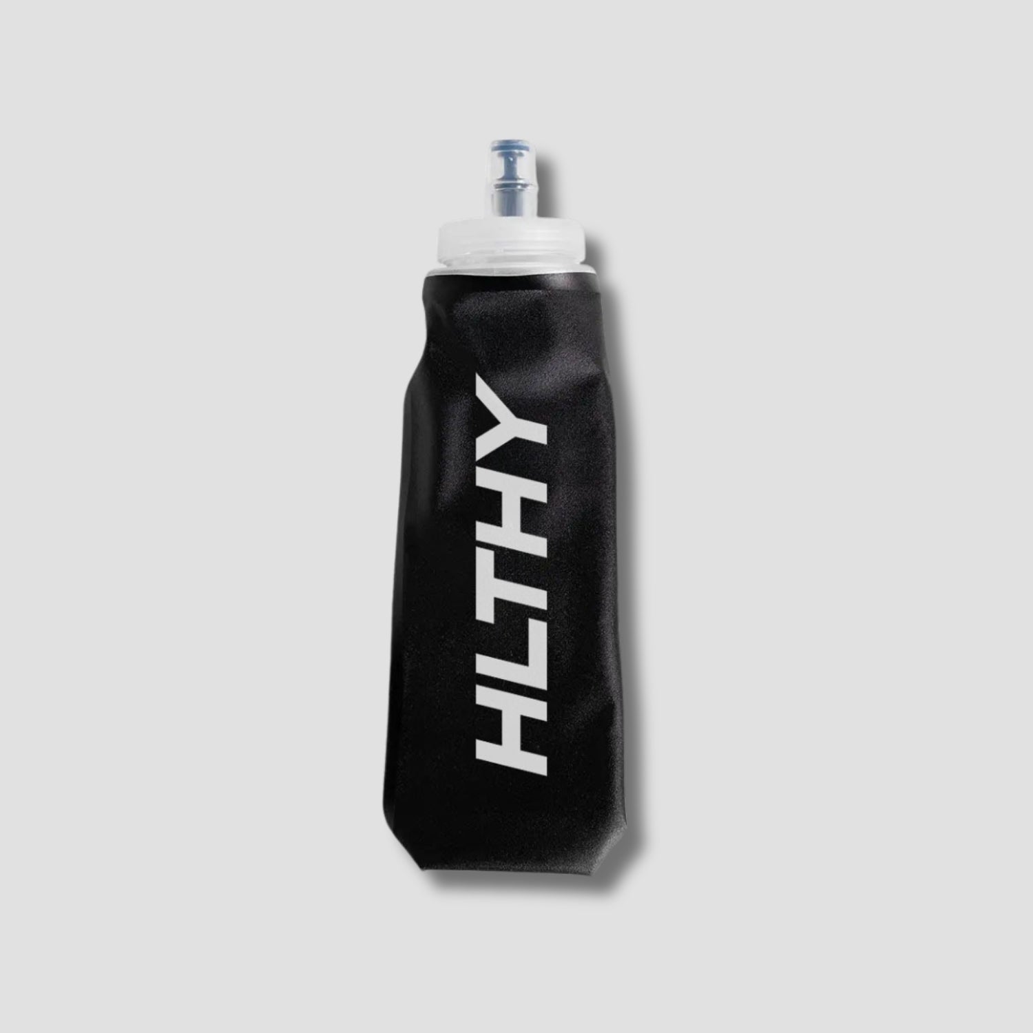 Flat lay of the HLTHY soft flask water bottle, showing its lightweight, flexible material and durable construction for long-term use