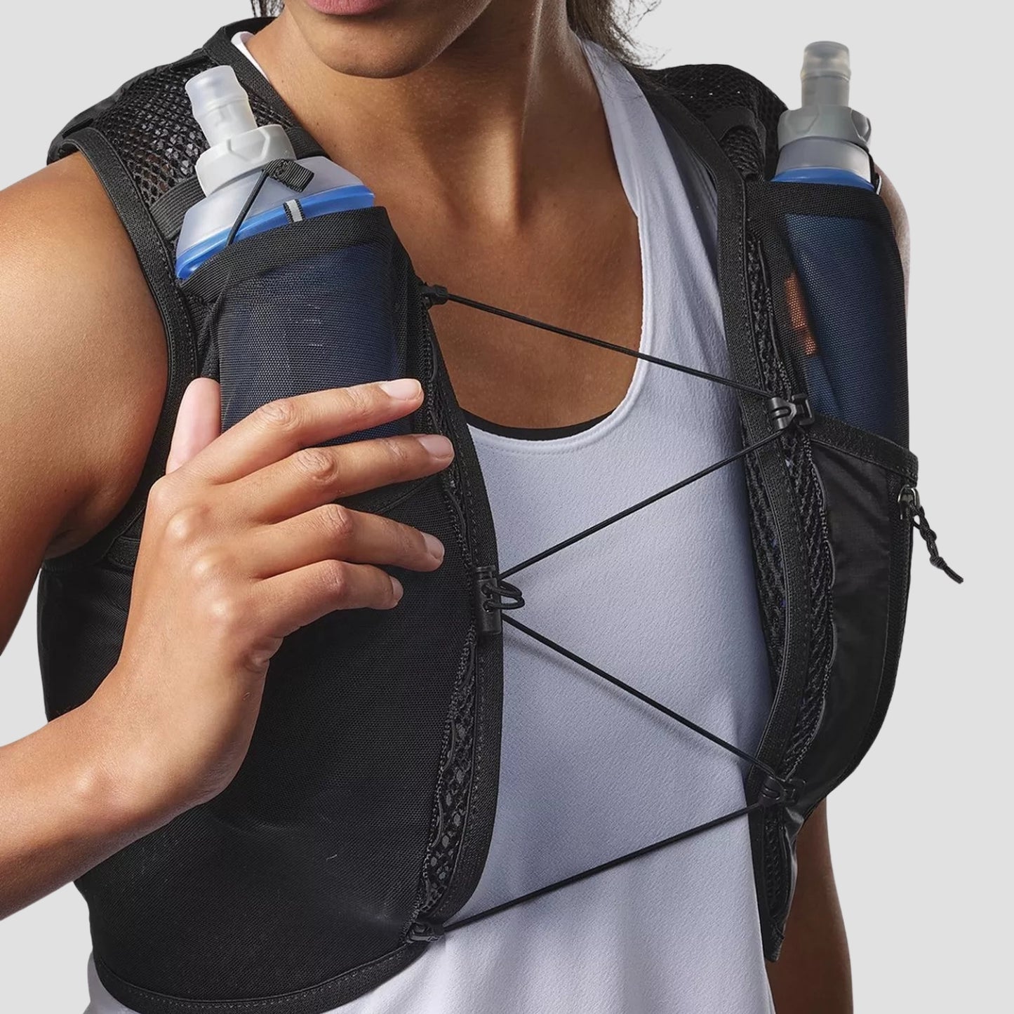 Side view of the HLTHY AEROSKIN hydration running vest, displaying its slim profile, adjustable straps, and easy-access side storage pockets